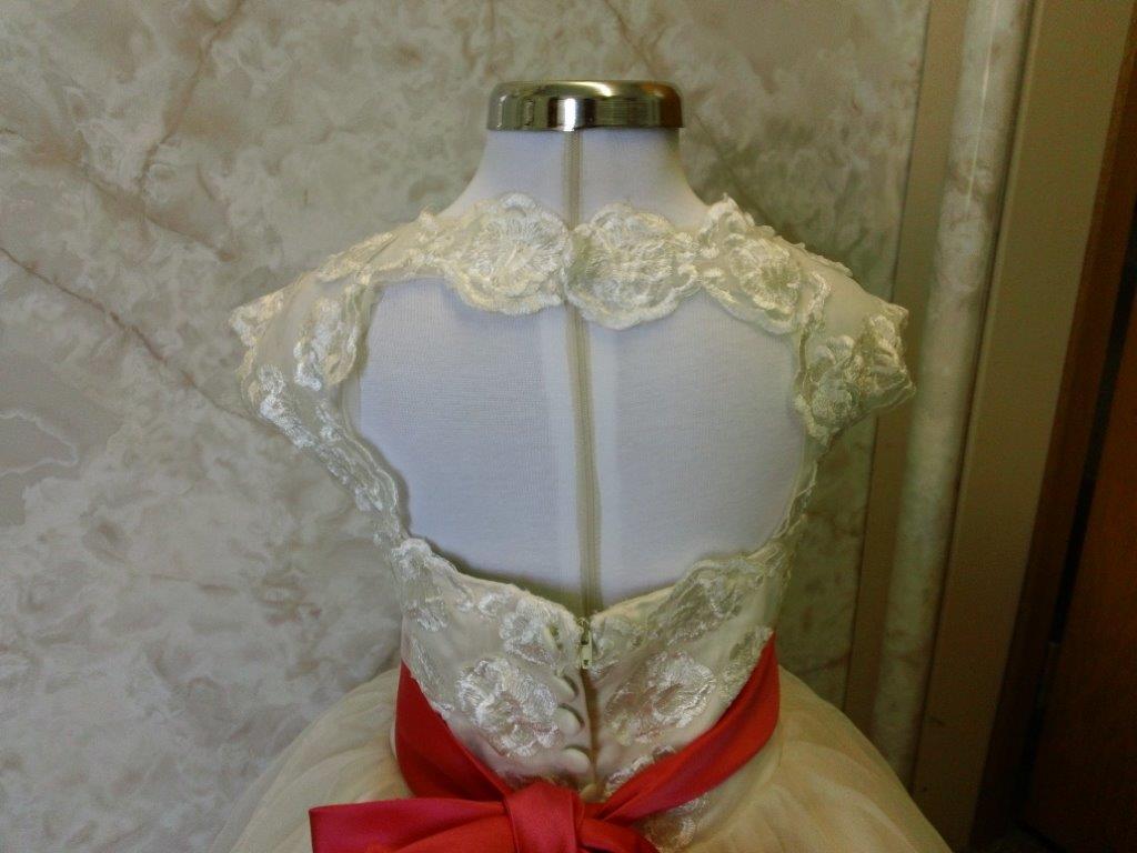 open back miniature bride dress with coral sash