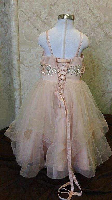 Sherbet flower girl dress was designed to Match our brides Lazaro 3250 wedding dress