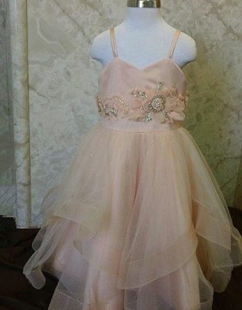 Sherbet flower girl dress was designed to Match our brides Lazaro 3250 wedding dress