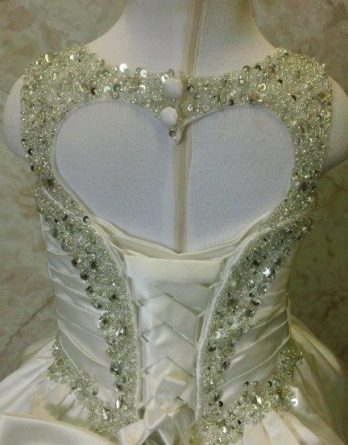 Jewel encrusted flower girl dress with heart cutout in back