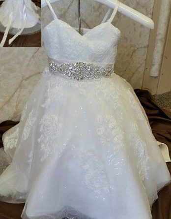 Wedding dress for baby girls, with a tiny train. Baby flower girl dress with sparkling sequins and crystal beaded sash.