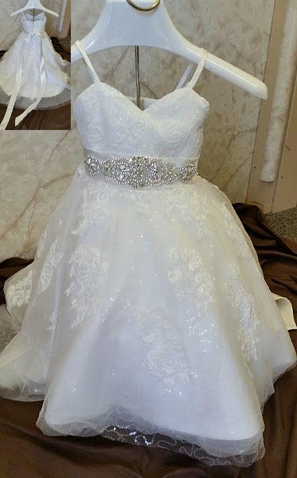 Wedding dress for baby girls, with a tiny train. Baby flower girl dress with sparkling sequins and crystal beaded sash.