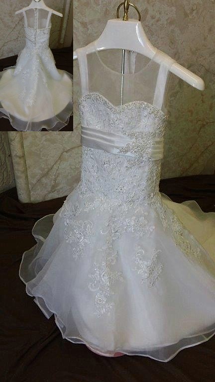 Sheer illusion neck flower girl dress designed to match the brides gown.