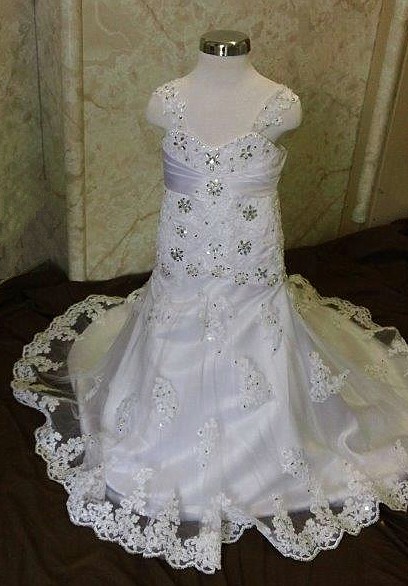 White lace flower girl dress with train. Illusion strap sweetheart dress with silver beading.