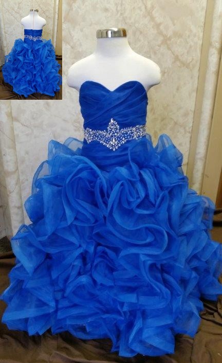 Royal blue sweetheart flower girl dress with beaded waist, and ruffle skirt.