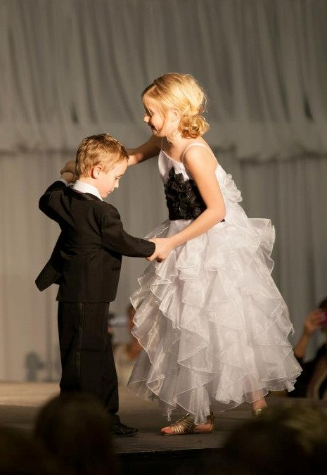 White and black floor length ruffle layered party dress. Fully lined with additional netting under the skirt.