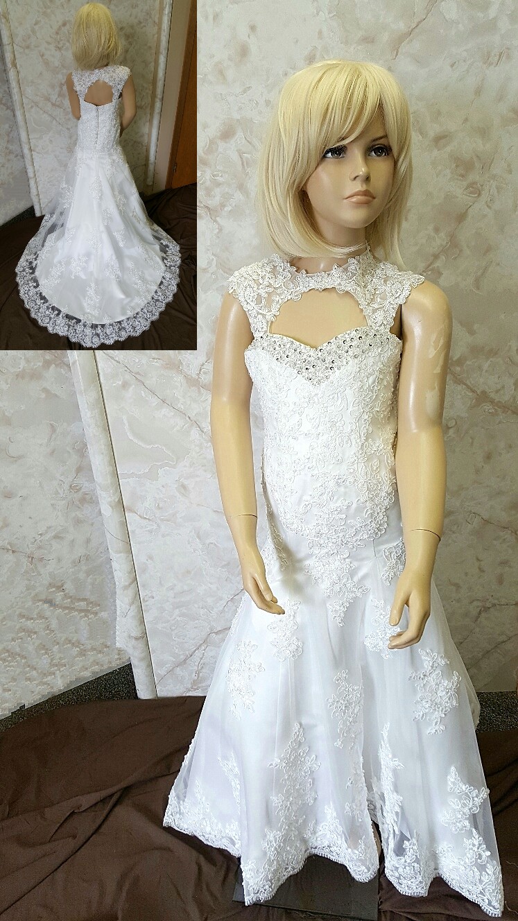 Designer mermaid flower girl dress with cutouts. It was created by Jaks, to perfectly match the brides gown.