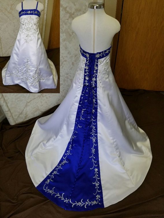 White dress for wedding flower girls. Royal blue trimmed neckline, lace up back and chapel train with beaded embroidery.