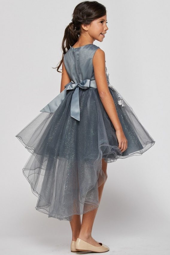 Girls hi low dresses are heading to the parties. Sleeveless, hi low dress with 3D floral bodice, and sheer tulle train.