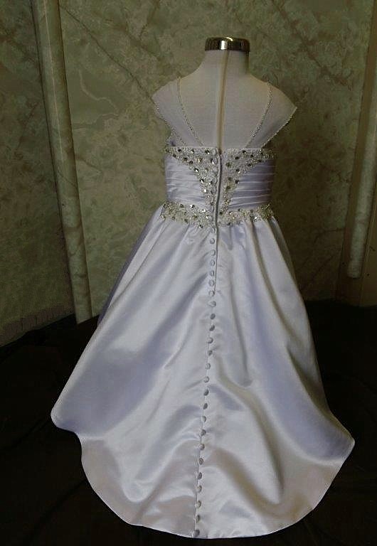 Sweetheart miniature crystal wedding dress has ruched crystal bodice. Covered buttons run down the length of the train.