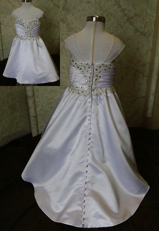 Sweetheart miniature crystal wedding dress has ruched crystal bodice. Covered buttons run down the length of the train.