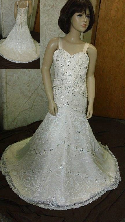 Lace fit and flare flower girl dress accented with crystals.