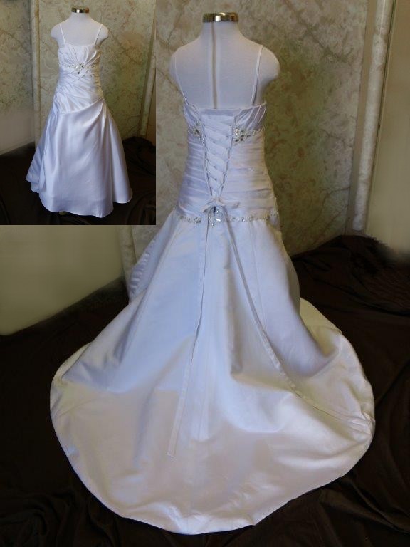 Toddler size wedding gown with a jeweled empire waist and floor length skirt with a train