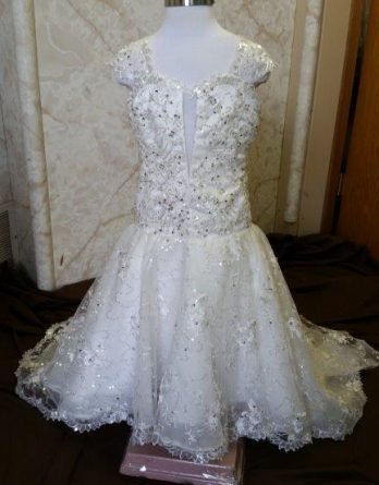 Fit and flare flower girls wedding dress with sweetheart neckline.