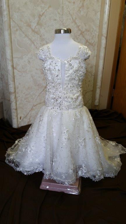 Fit and flare flower girls wedding dress with sweetheart neckline.