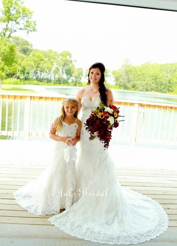Lace mermaid flower girl dress with fitted sweetheart neck accented with crystals.