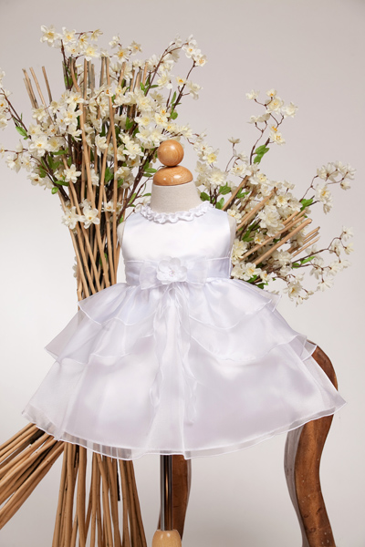 Cheap fancy baby dress priced at $25. Trimmed neck, tiered skirt with front bow complete this adorable baby dress.