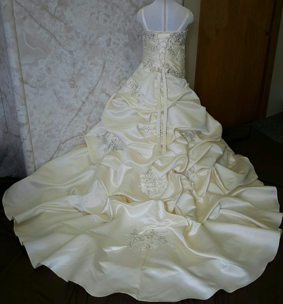 Mother daughter wedding dresses. This Flower girl dress has a billowing waterfall train to match her mothers bridal gown.
