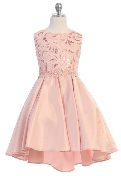 Girls formal blush dresses. Sleeveless dress with round neck, shiny pattern bodice, high low skirt with pleated back.
