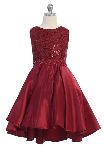Girls formal burgundy dresses. Sleeveless dress with round neck, shiny pattern bodice, high low skirt with pleated back.