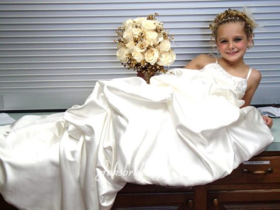 floor length flower girl dress matches bride