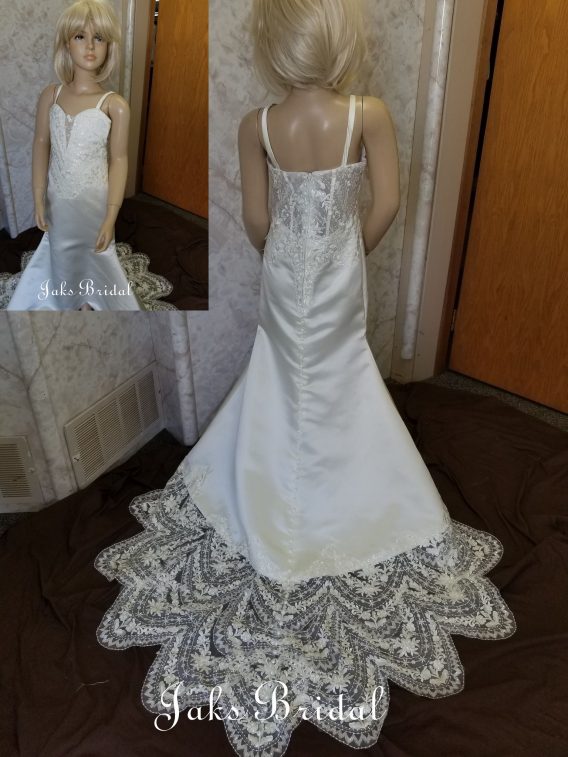 Plunging lace miniature bride dress, with scalloped lace train.