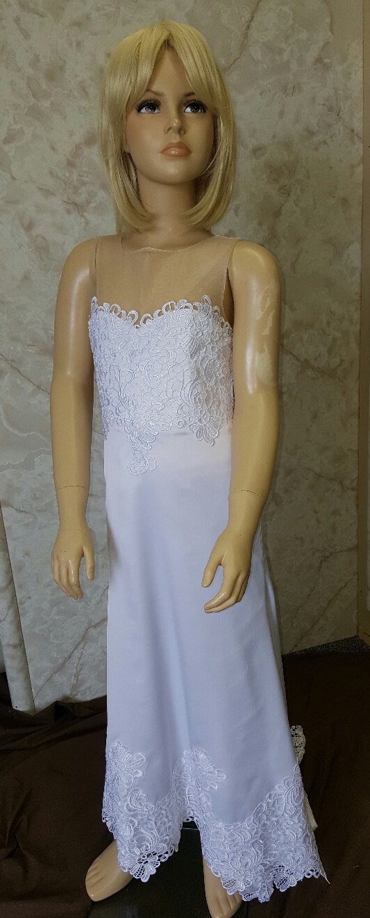 This sleeveless crepe flower girl dress has a lace-covered bodice, a long scalloped-lace train, and an illusion back.