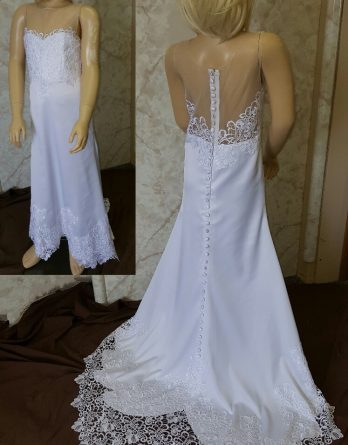 This sleeveless crepe flower girl dress has a lace-covered bodice, a long scalloped-lace train, and an illusion back.