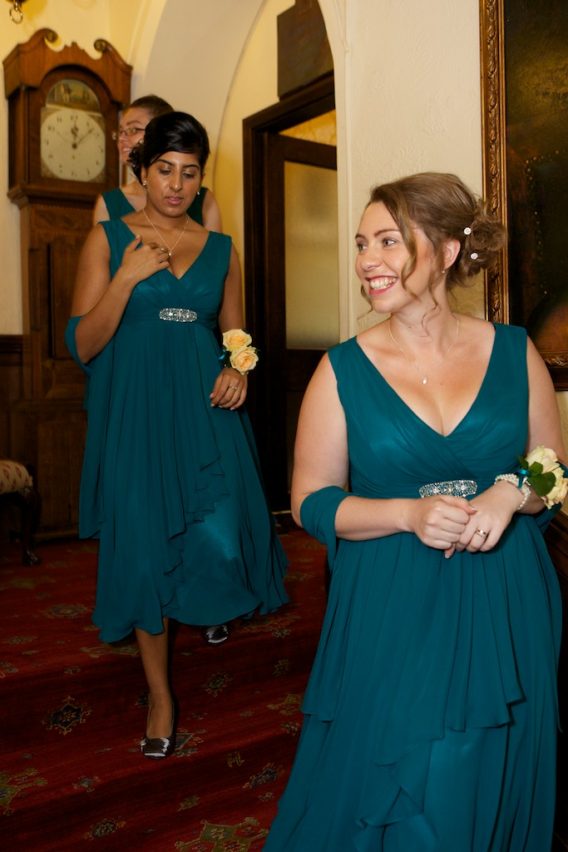 V-Neck Short Chiffon A-line Bridesmaid Dress With an Empire Waistline accented with a Brooch.