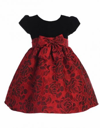 Classic Christmas dress for your little girl from Lito. The short sleeved velvet top leads to a floral jacquard skirt. Underskirt for added fullness and sash ties in back.