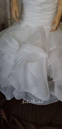 Sweetheart spaghetti strap flower girl dress with ruffle layered fit and flare skirt.