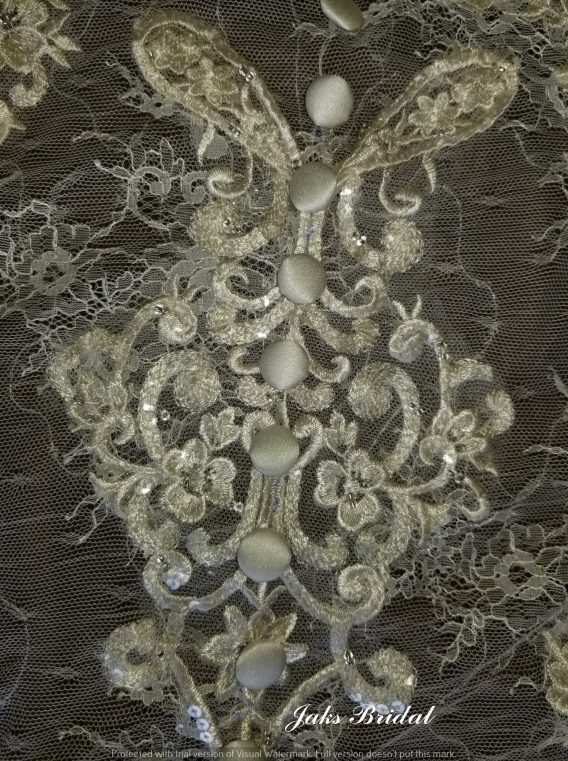 Stunning lace train on this original flower girl dress.