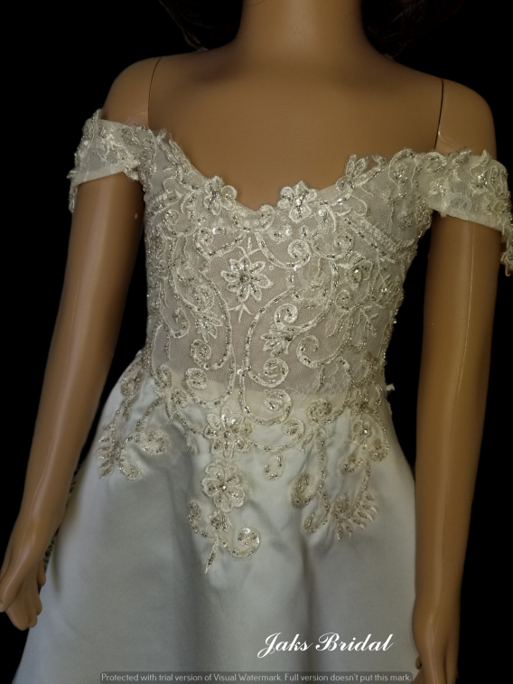 An original off the shoulder flower girl dresses. Beautiful Lace Bodice with a Lace Applique Train Flower Girl Dress.