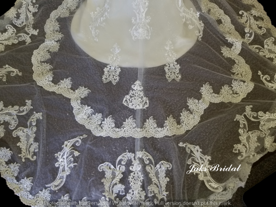Stunning lace train on this original flower girl dress.