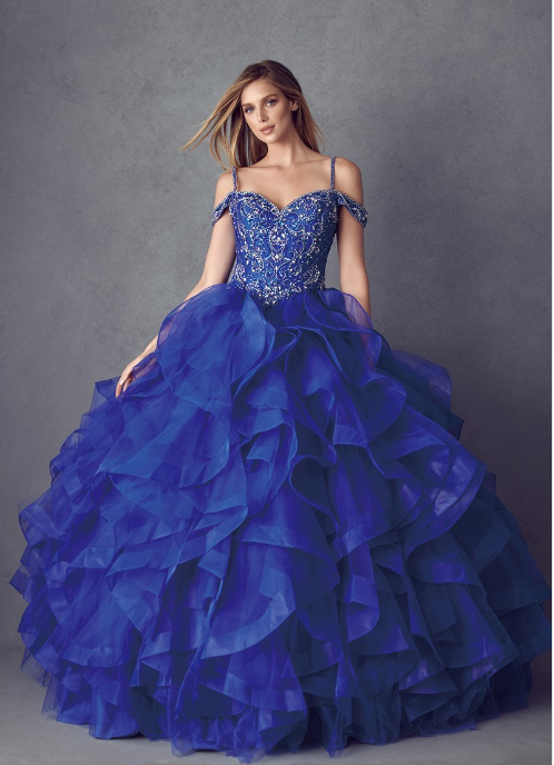 This beautiful cold shoulder royal blue gown features a sweetheart bodice accented with crystal beading, floor-length skirt with ruffles, and a lace-up back with zipper closure. Ruffled Cold-Shoulder Ball Gown, on sale for $338.