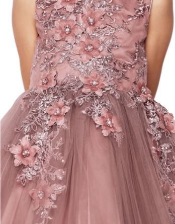 Short mauve tulle floral dress features a sleeveless bodice adorned with 3D floral appliques accented with beads and glitter.
