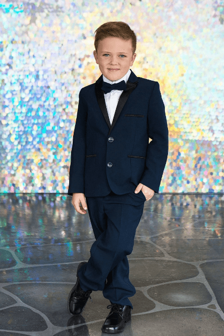 This 4-piece Tuxedo set includes Jacket, shirt, pants, and wrap around bowtie. We offer these tuxedo suits for infant and toddler to teen boys.