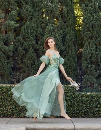 Sleeveless sage green prom dress with illusion V-neck bodice with removable puff sleeves and corset boning.