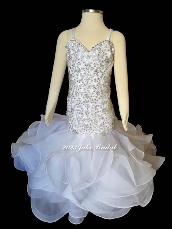Organza mermaid flower girl dress. Sweetheart neck beaded fitted bodice, spaghetti straps, and spectacular ruffled skirt.