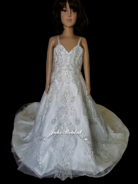 This children's size wedding gown will give a magical entrance for your flower girl. A-line beaded lace dress designed to match a bridal gown.