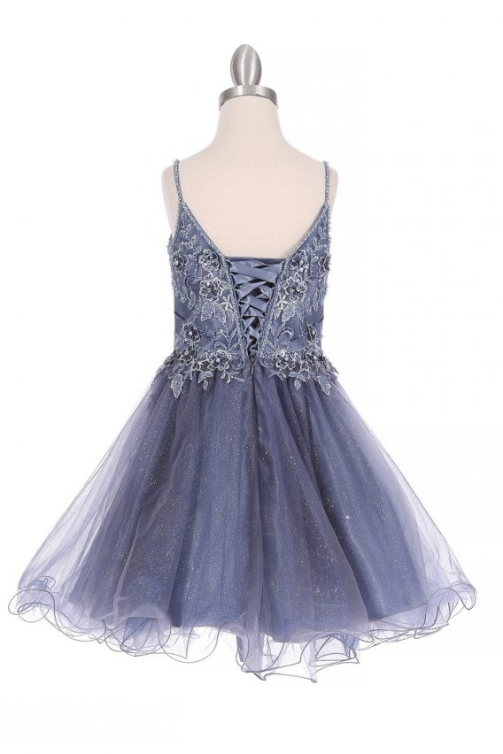 Girls rhinestone tulle A-line short party dress with a wired bottom skirt. Accented with beads, flowers, and rhinestones.