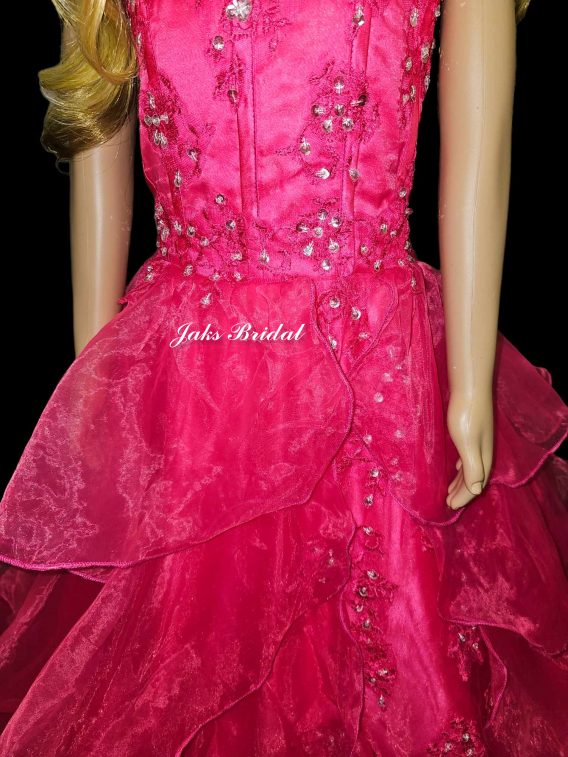 little girls formal dresses.  A hot pink organza halter neck ruffled ball gown, with bead and sequin detailed bodice, and a lovely, tiered ruffle skirt.